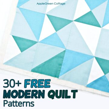 a closeup of an unfinished quilt in aqua blocks with a modern quilt pattern