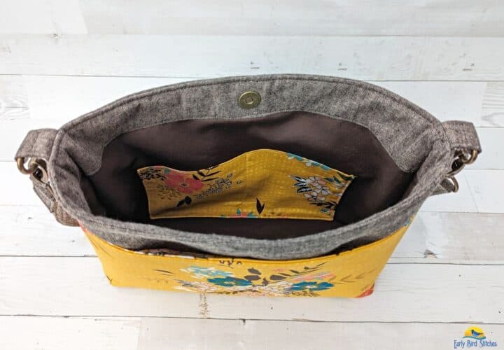 a handmade bag sewn with with brown and yellow cotton prints showing a slip pocket in lining