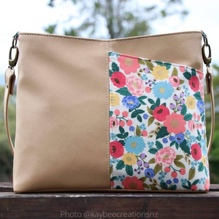 front side of a finished handbag, with a half-width slip pocket and a vinyl base