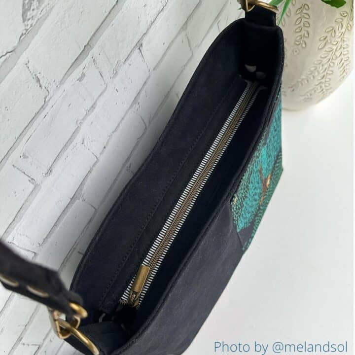 the top view of a handmade bag with a front exterior pocket, showing a recessed top zipper panel