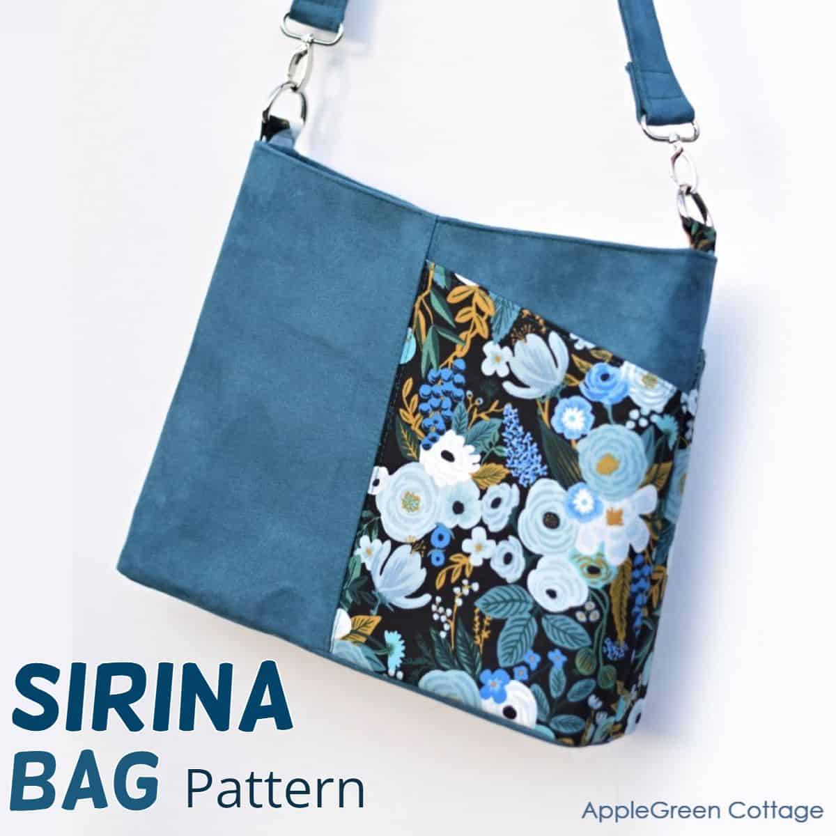 finished handmade purse with a shoulder strap in blue faux leather and floral fabric