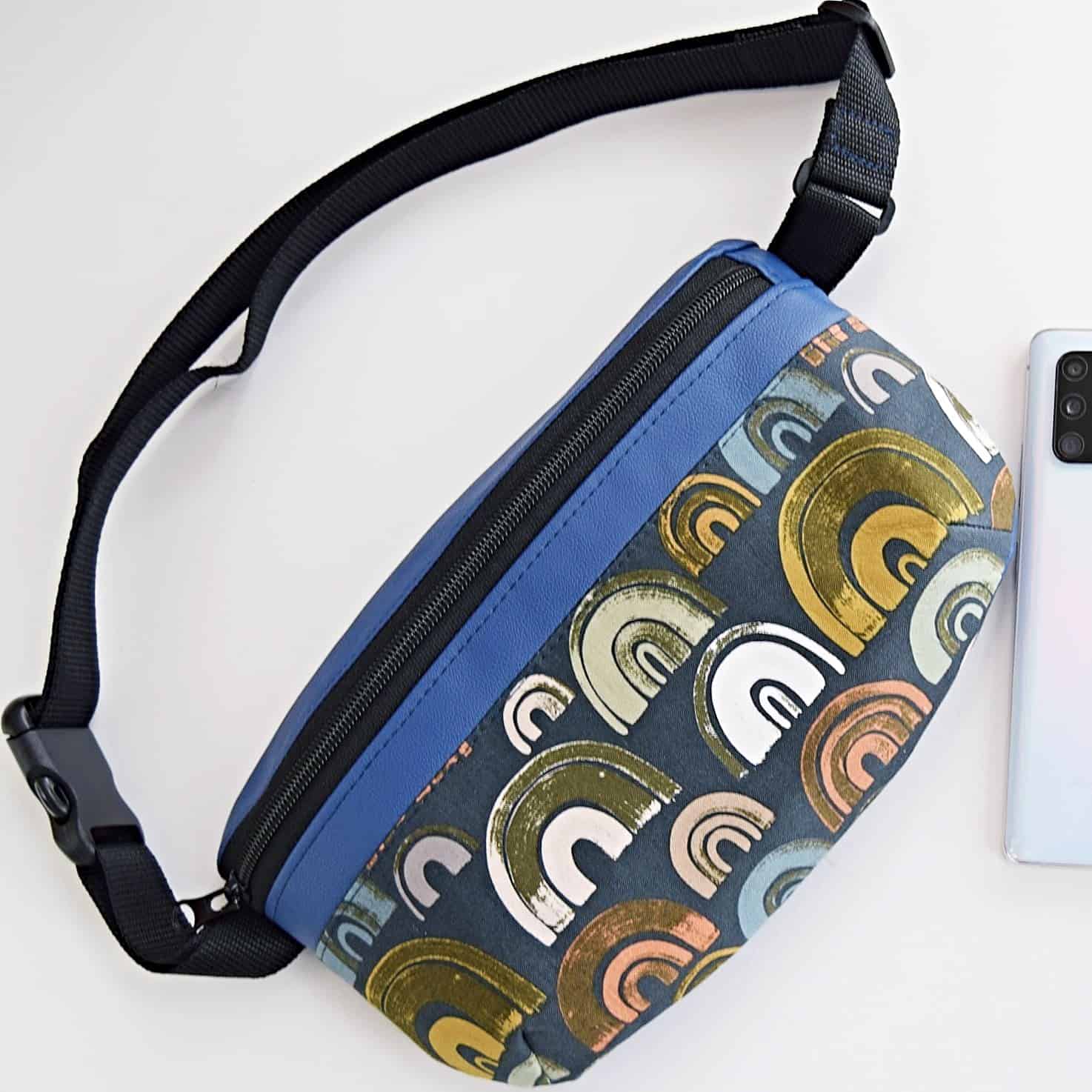 finished zarya fanny pack bag in navy faux leather and a modern quilting cotton print