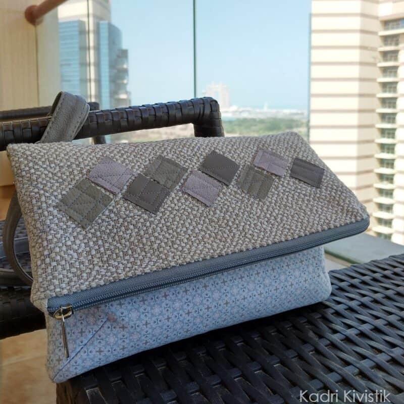a finished handmade foldover clutch made with decor-weight fabric