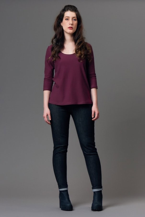 a woman wearing a handmade fitted top with three quarter sleeves