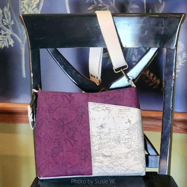 a finished classic shoulder bag with a front pocket in purple