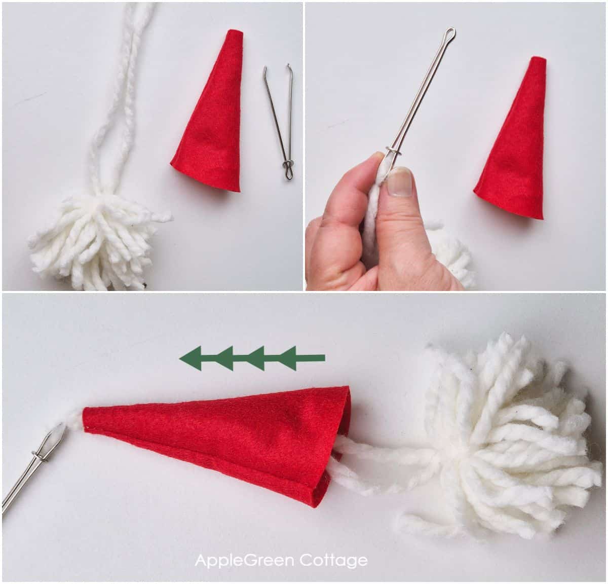 a white pompom with a strand of yarn being pulled through a red gnome hat