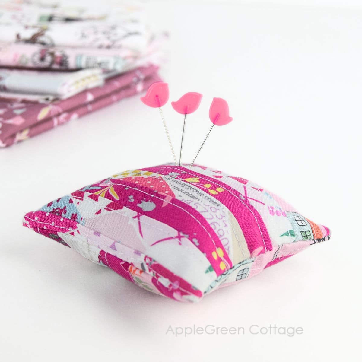 a cute scrappy diy pincushin sewn with an applegreencottage pincushion tutorial
