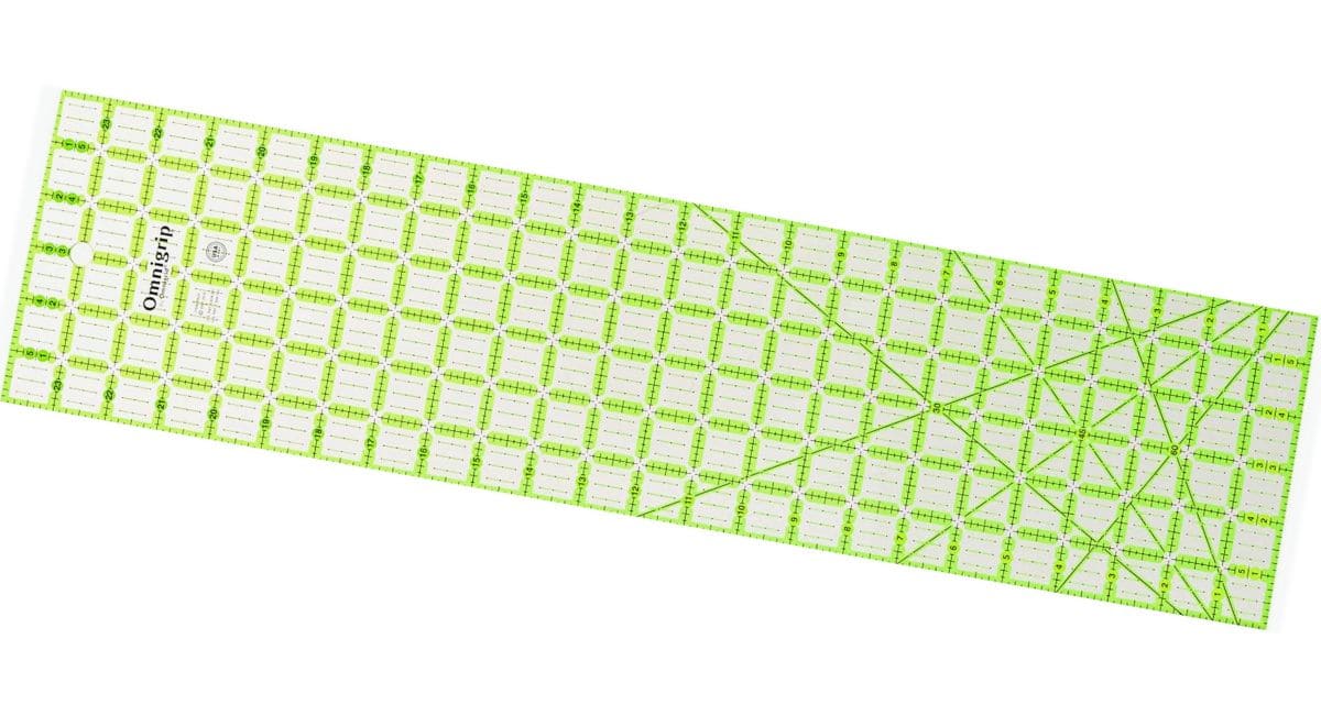 large Omnigrip quilting ruler with bright green and black gridlines, perfect for cutting yardage