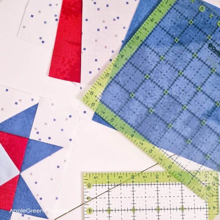 Quilting rulers alongside bold red, white, and blue quilt blocks. Perfect for crafting patriotic or beginner-friendly quilting patterns.