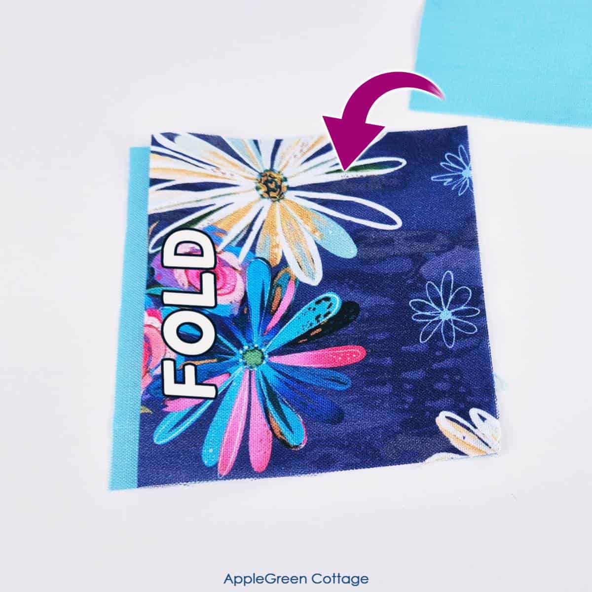 A floral fabric piece partially folded and labeled 'FOLD,' with a bright arrow indicating the next folding step.