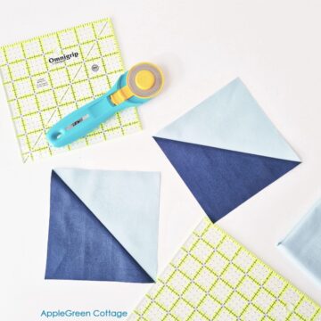 Half-square triangle (HST) quilt blocks with a rotary cutter and quilting ruler, demonstrating the 2-at-a-time method for beginners.