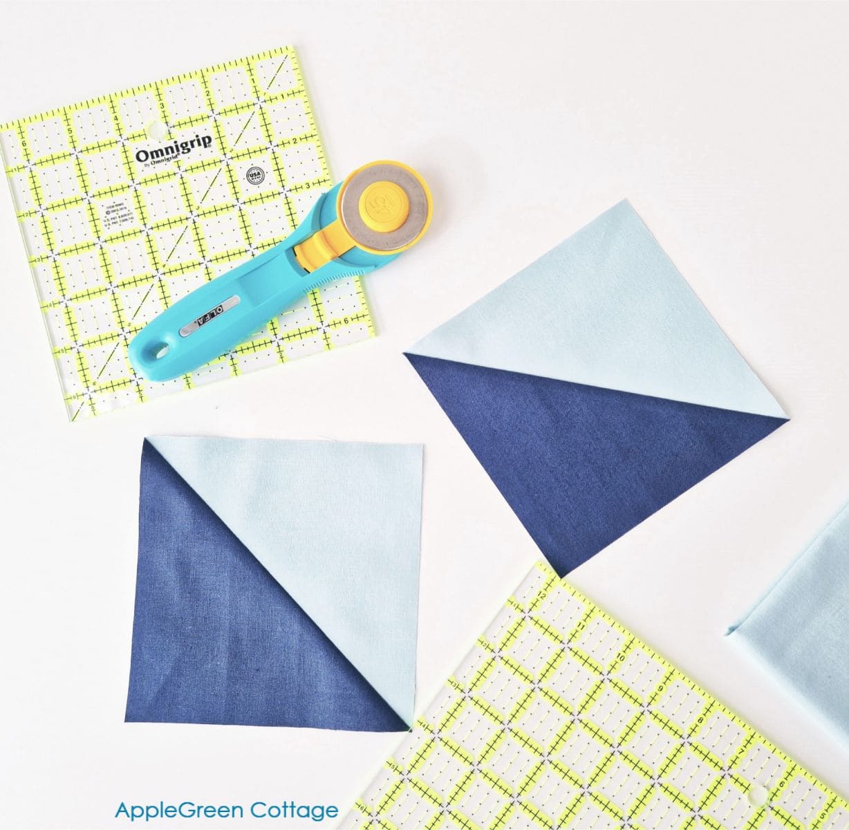 Half-square triangle (HST) quilt blocks with a rotary cutter and quilting ruler, demonstrating the 2-at-a-time method for beginners.