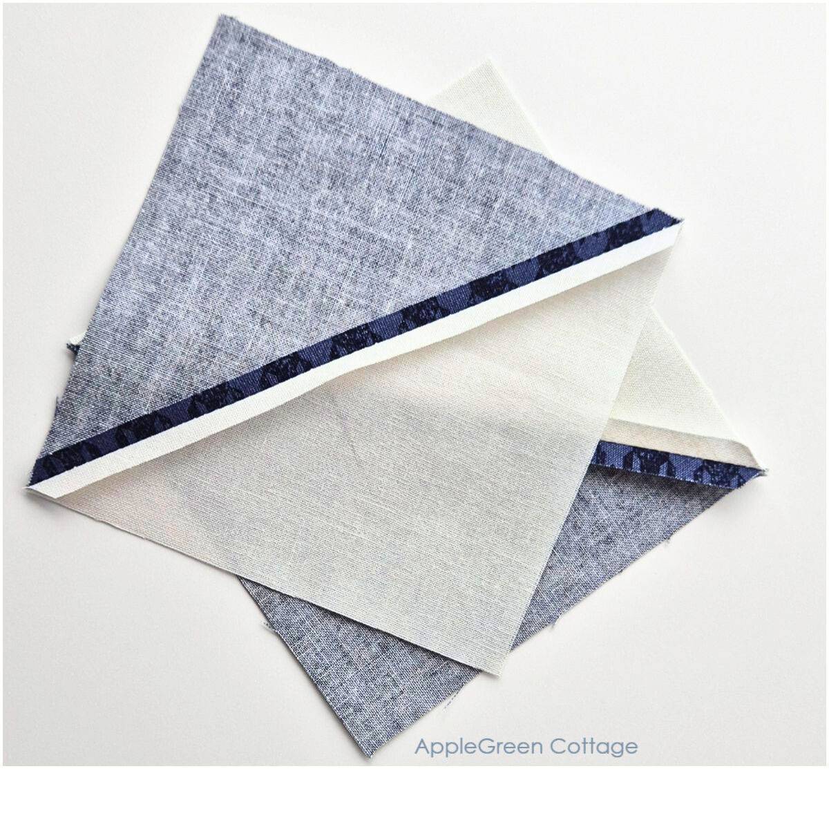 Neatly pressed half-square triangles with seams open for flat quilting results.