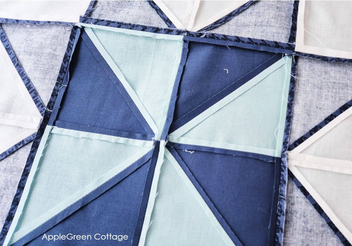 Back of a quilt showing neatly pressed seams for a clean and professional finish in quilting.