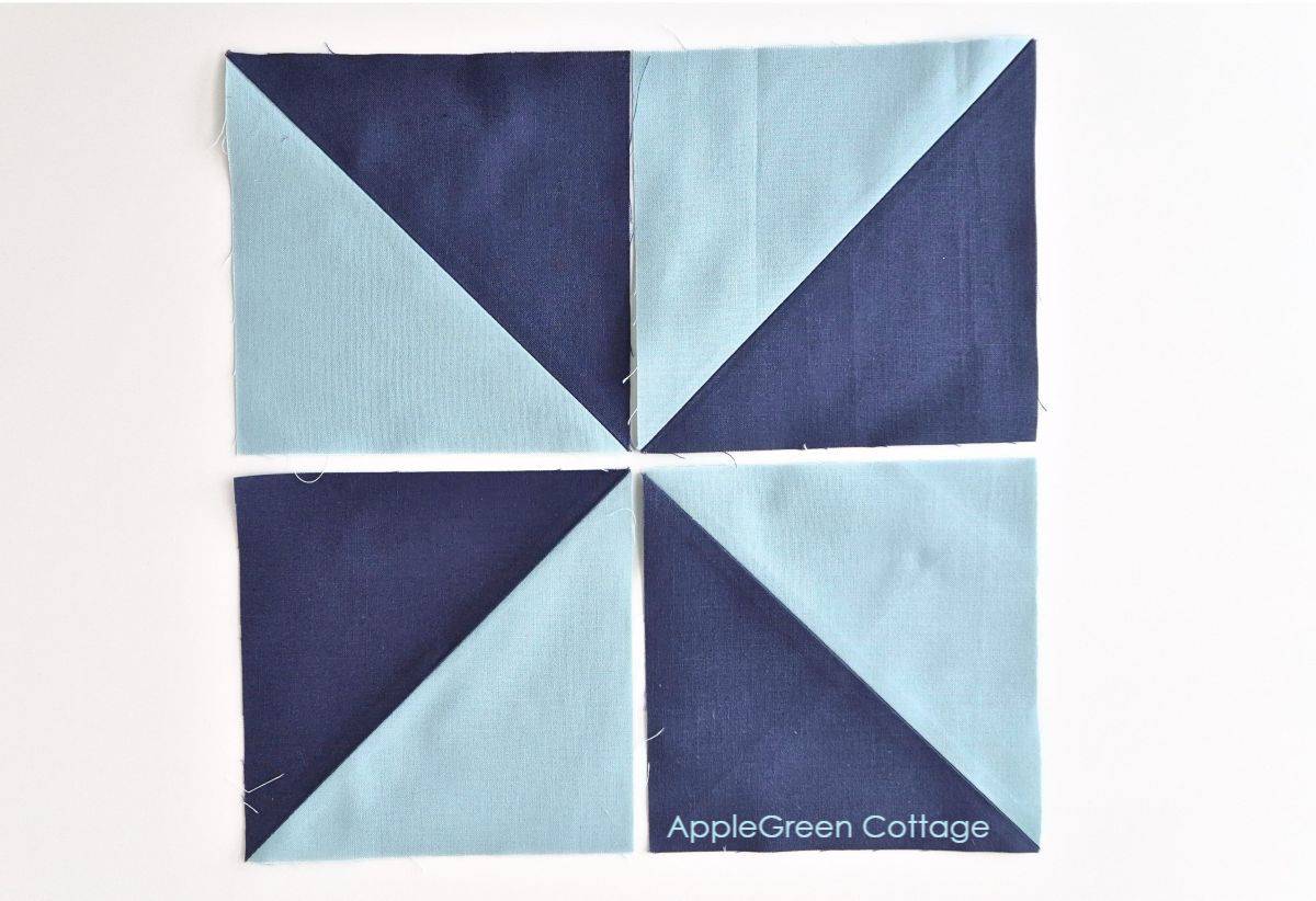 Four HST units arranged in a pinwheel design, ready to be sewn together.