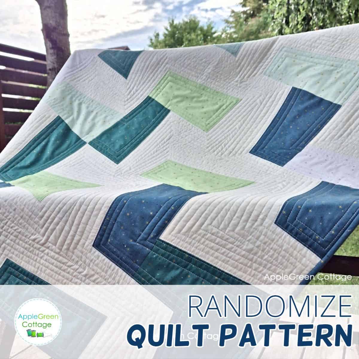 a finished modern quilt in white, aqua, green and teal on a garden bench in a backyard