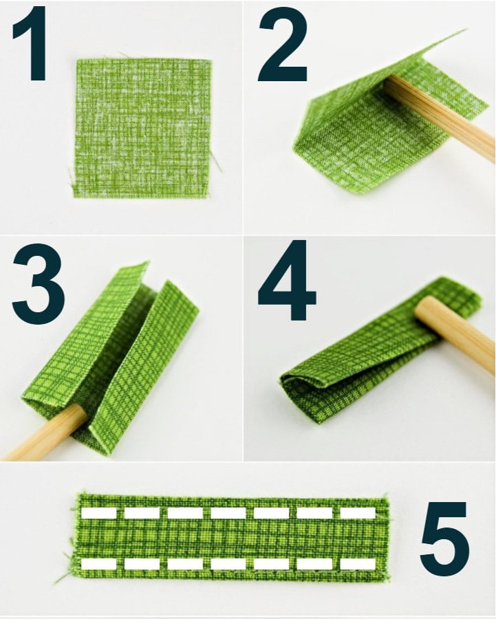 a green cotton printed fabric square being folded into a bag anchor tab.