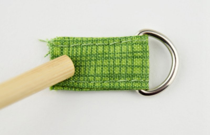 A bag anchor tab with a d-ring attached.