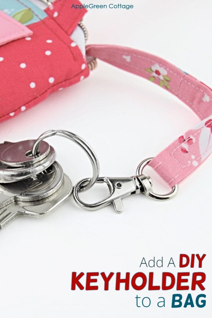 a handmade bag with an inserted detachable keyholder in beautiful red floral print with keys attached.