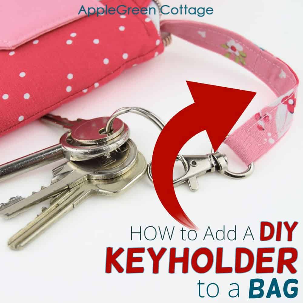 a handmade bag with an inserted detachable keyholder in beautiful red floral print with keys attached.