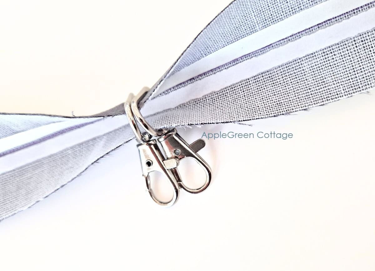 Swivel hooks on bag strap before stitching.