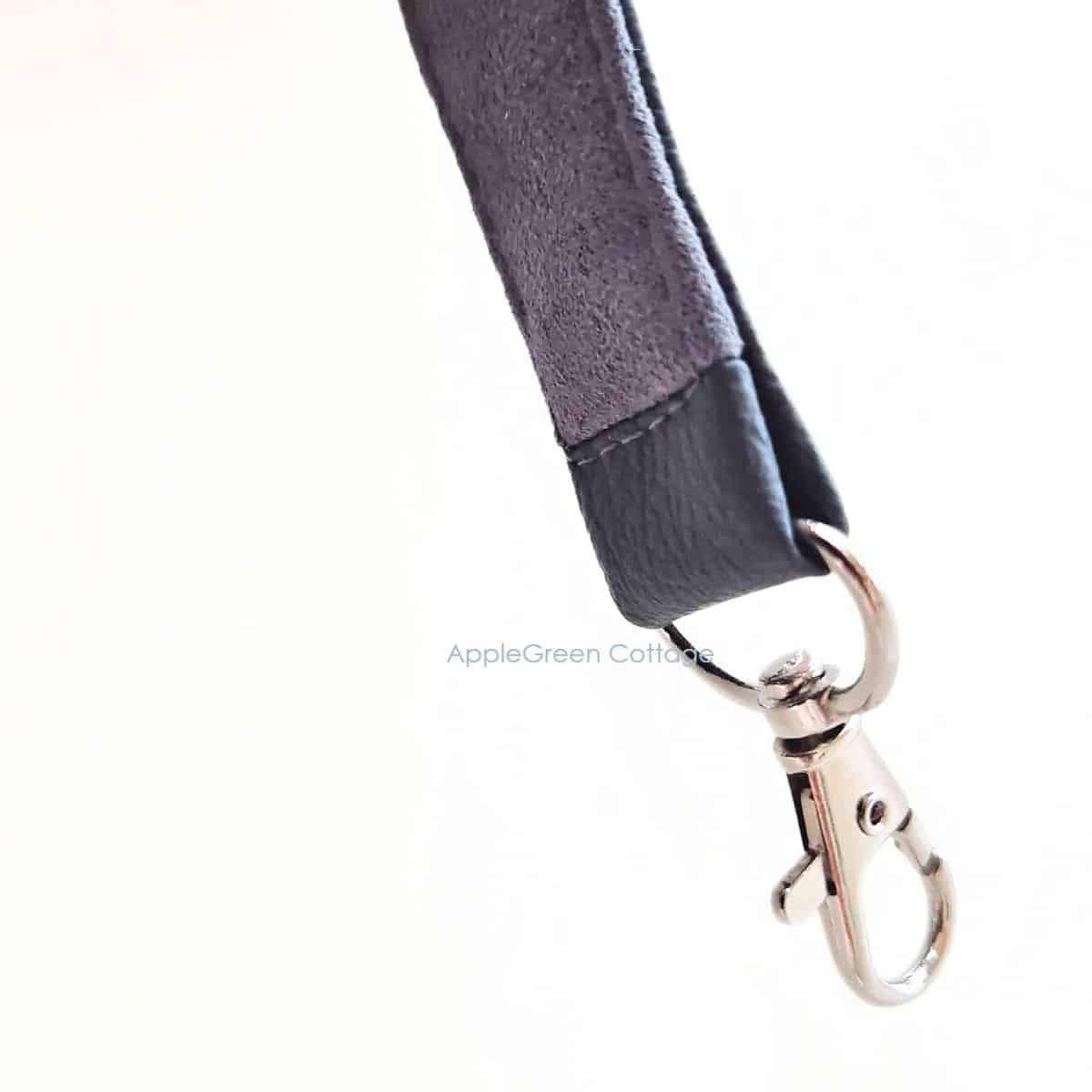 Close-up of DIY shoulder strap swivel clasp attached with neat stitching.