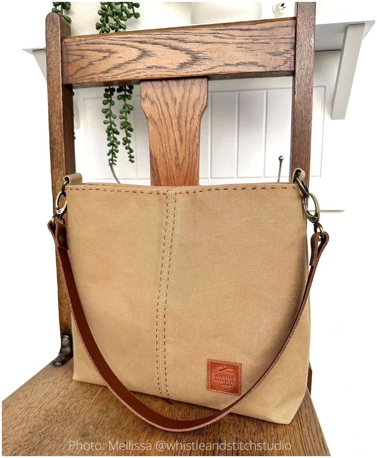 Handmade Lumera bag interior with floral lining, zip pocket, and magnetic snap closure.