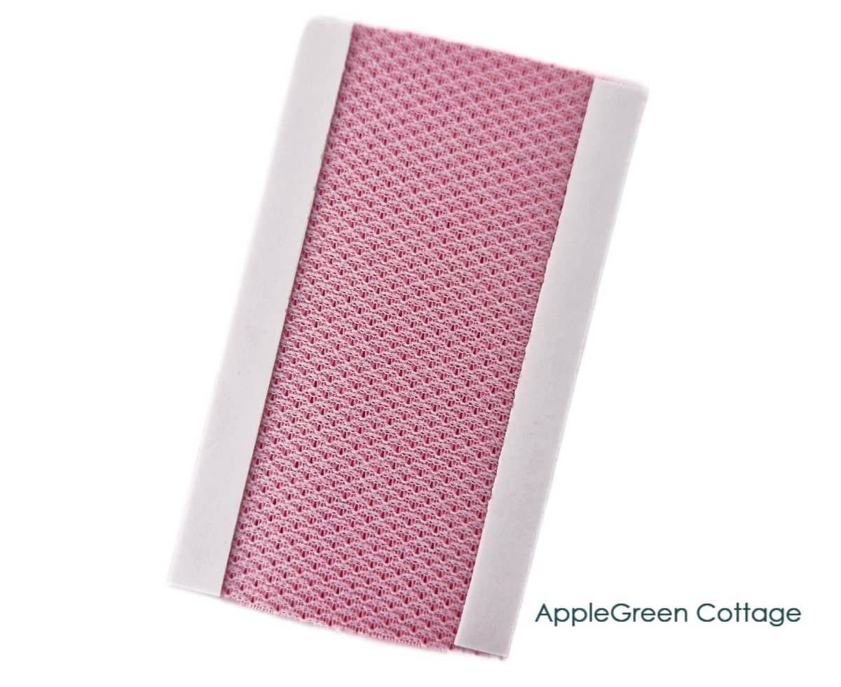 Faux leather connector piece with double-sided tape applied along both long edges.