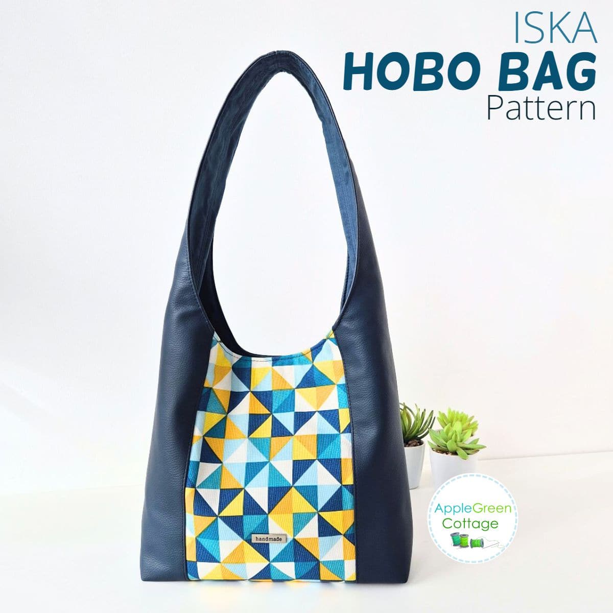 Navy and geometric ISKA hobo bag with center panel, shown as a finished handmade bag project.