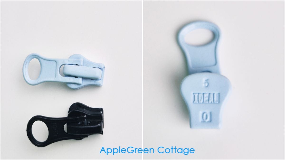 Two molded-plastic zipper sliders in different colors showing size markings for selecting a replacement.