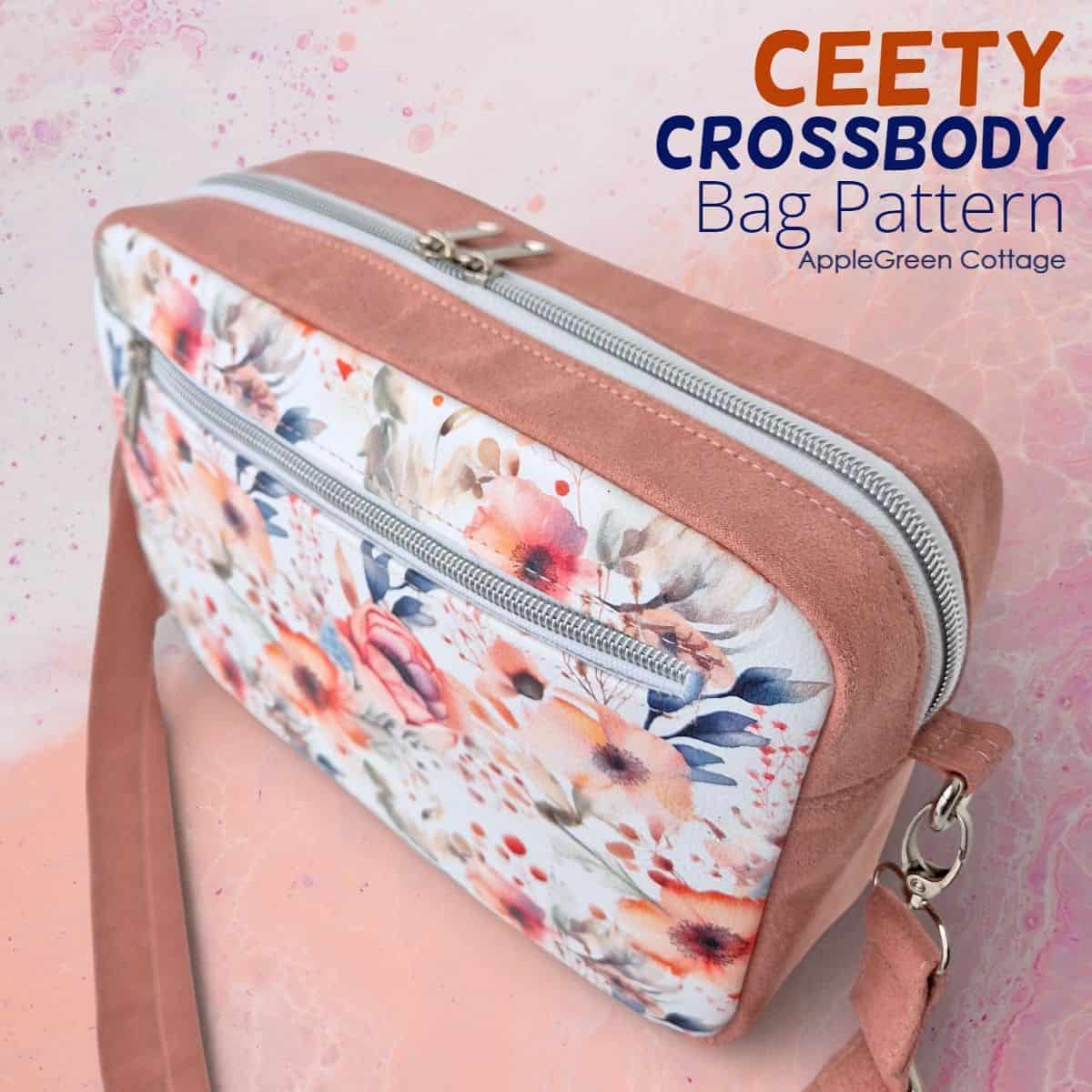 Handmade boxy crossbody bag with floral front pocket, double zipper top, and adjustable strap.