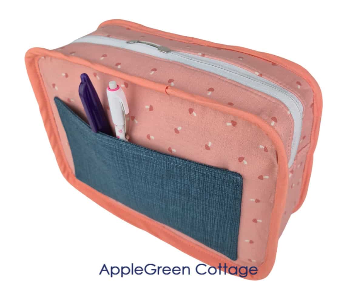 Finished boxy crossbody bag interior with slip pocket, bound seams, and zipper closure.