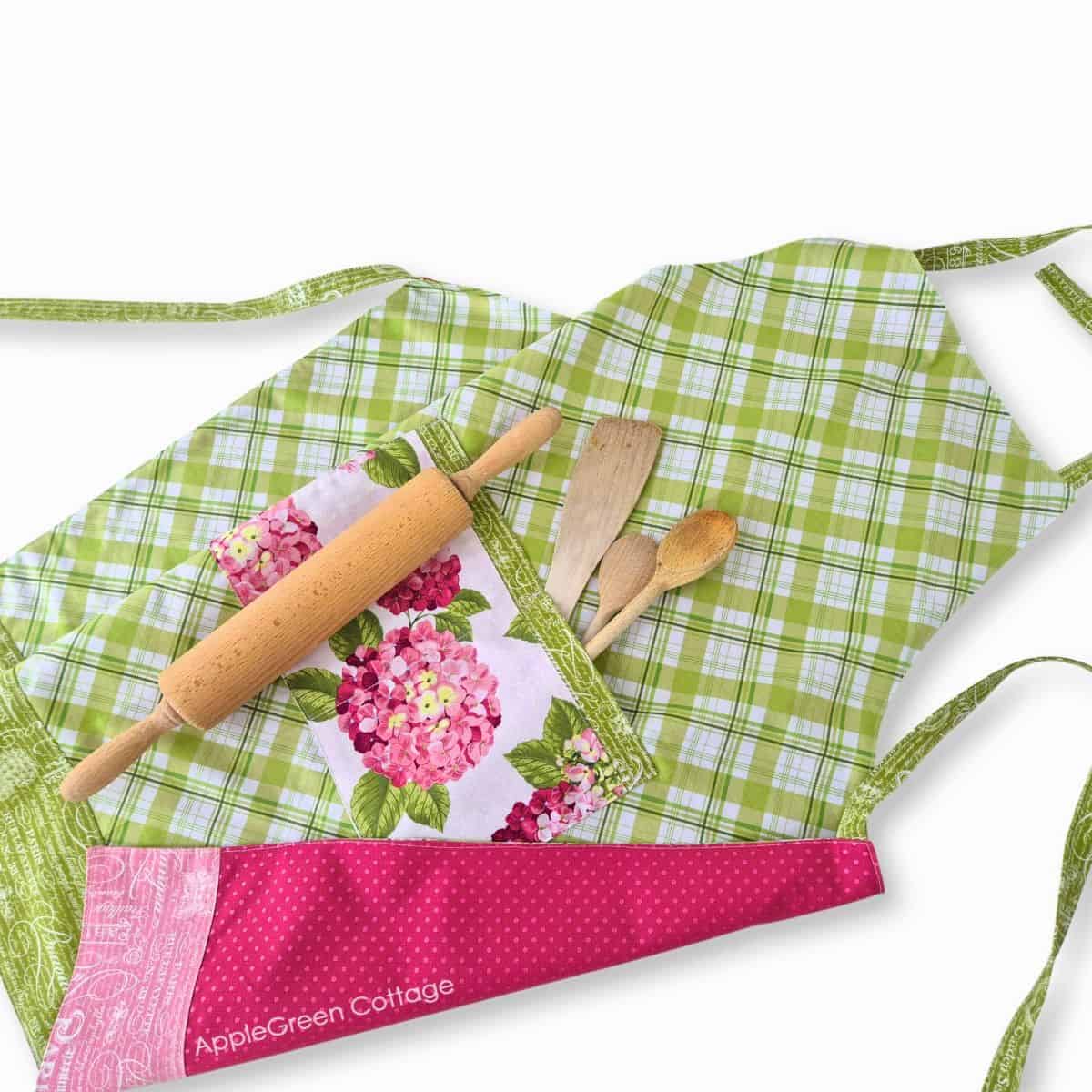 Finished reversible apron with large double pocket, shown with baking tools in use.