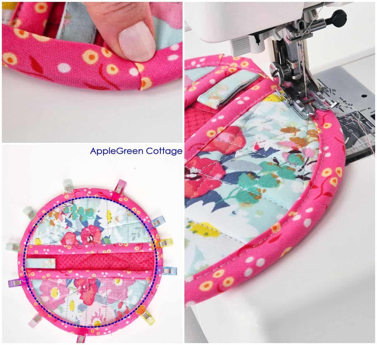 Close-up of round potholder with pockets and pink bias binding topstitching.