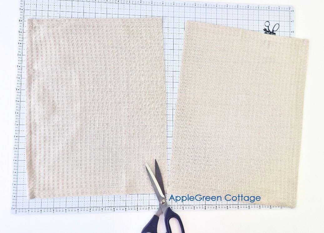 Two waffle weave kitchen towel pieces cut for a hanging towel sewing tutorial.