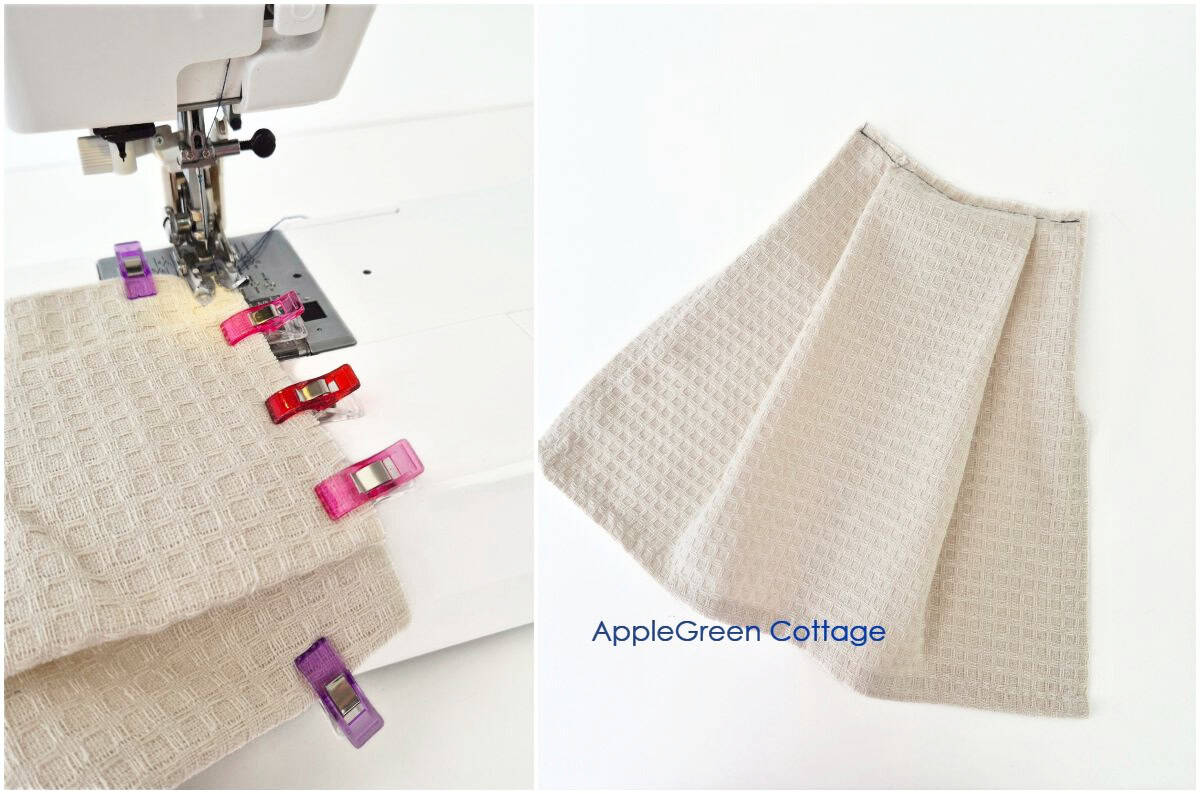 Stitching folded towel pleats at sewing machine for hanging dish towel tutorial.
