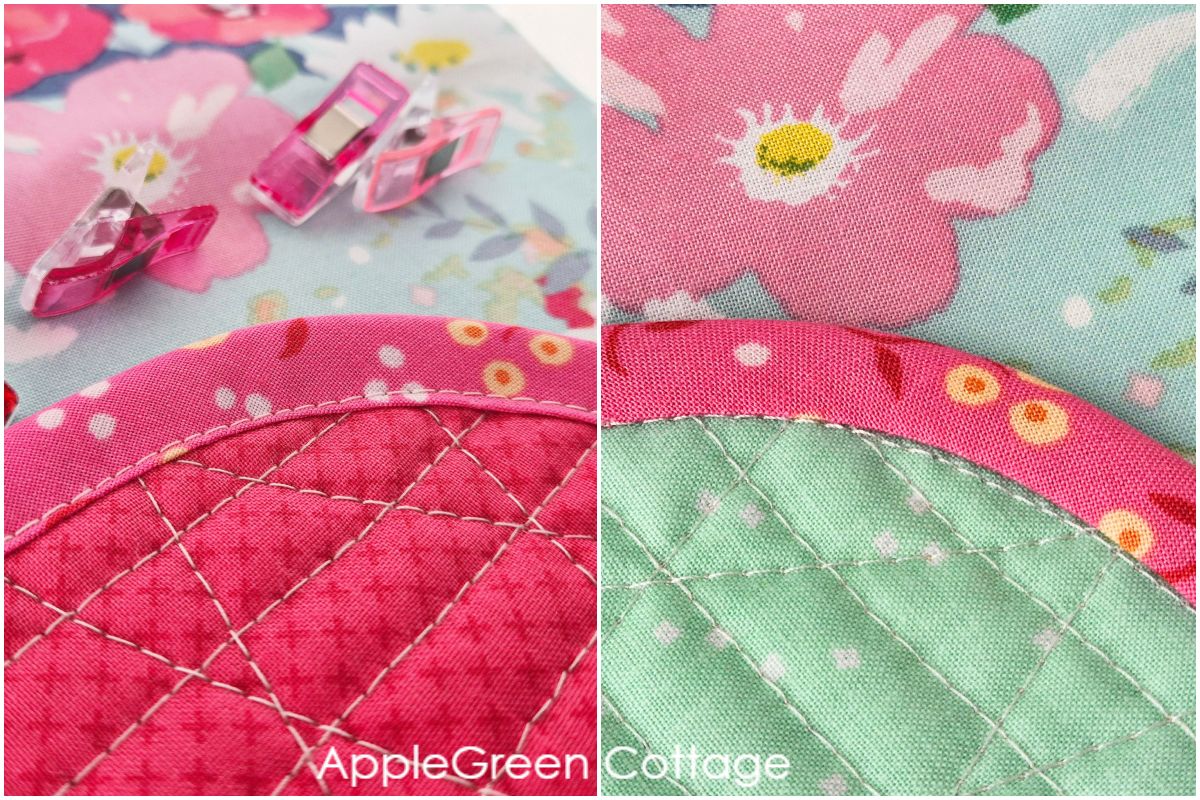 Finished bias tape on curved quilt edge with neat topstitching and smooth binding.